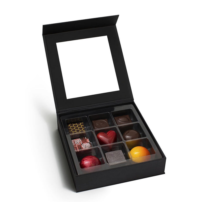 An assortment of milk and dark chocolate truffles showcasing Feve's top flavors.  A luxury chocolate collection like no other.  Makes a great holiday gift, business gift, or client gift.  Locally made in San Francisco with natural ingredients and sustainable, fair-trade chocolate.